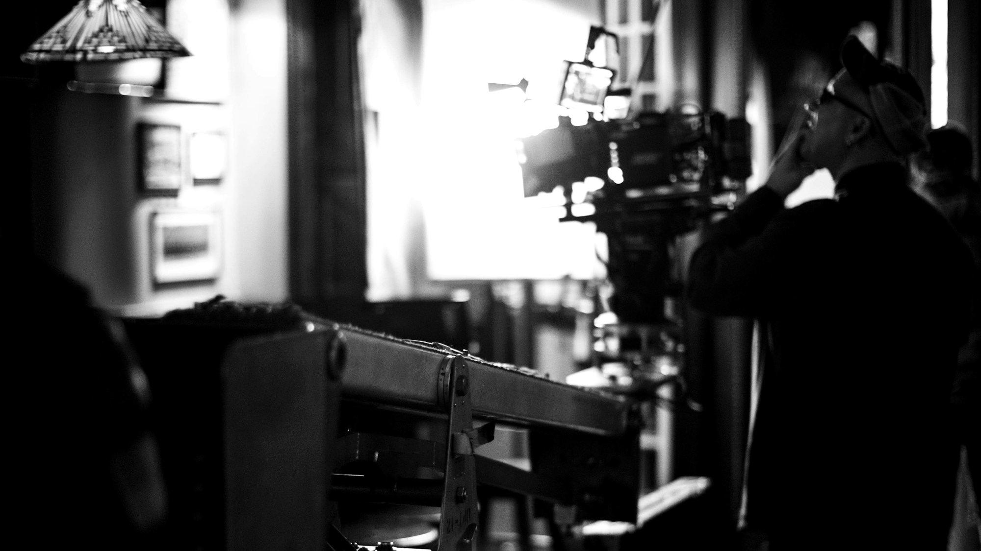 A man facing a professional film camera